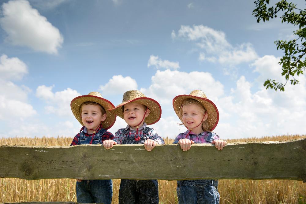 three boys in cowboy hats smiling | pediatric dentist spring branch tx
