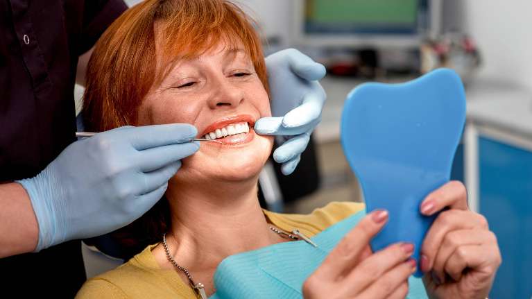 woman smiling with dental crown in Spring Branch, TX