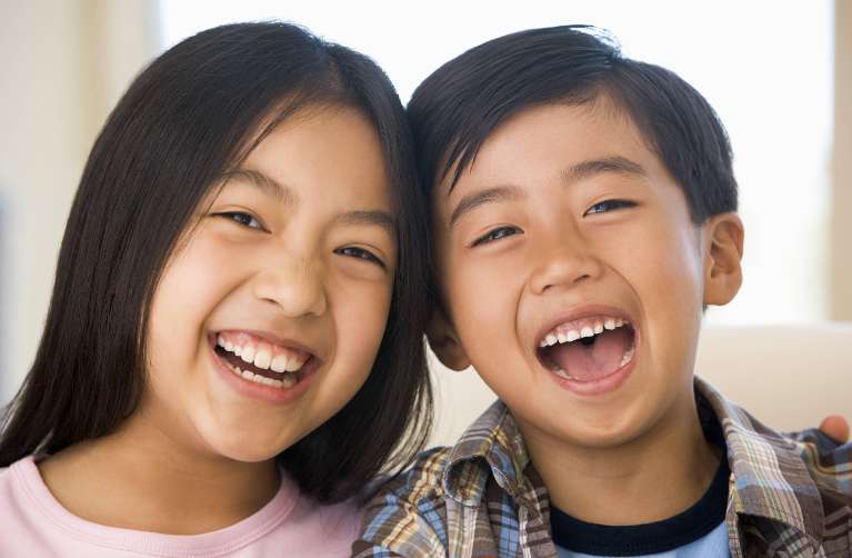 asian children laughing together | pediatric dentist spring branch