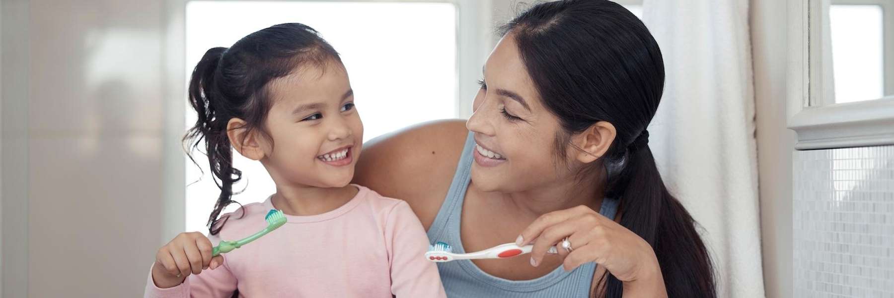 family dentist spring branch | mother and daughter brushing teeth