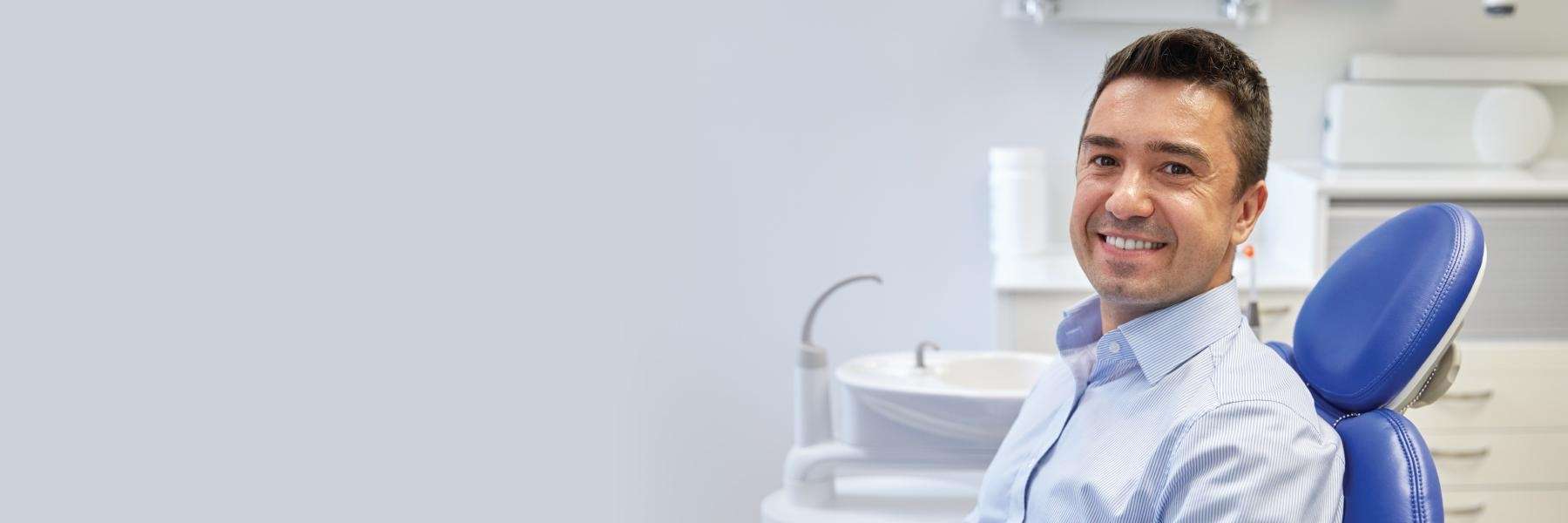 man smiling after tooth extraction