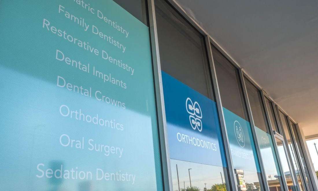 spring branch family dentistry | list of services on window